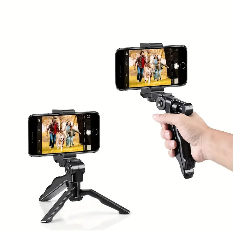 Hand holding a smartphone with a tripod and phone holder on a white background